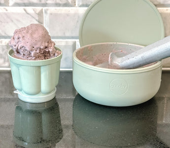 Mint green Catchy bowls with chocolate ice cream, ideal for mess-free mealtime on kitchen counter.