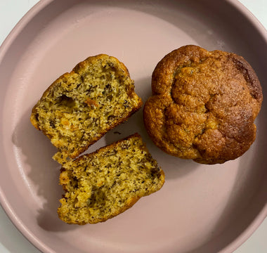 Fresh muffin sliced on pink plate, ideal for mess-free mealtime with easy cleanup